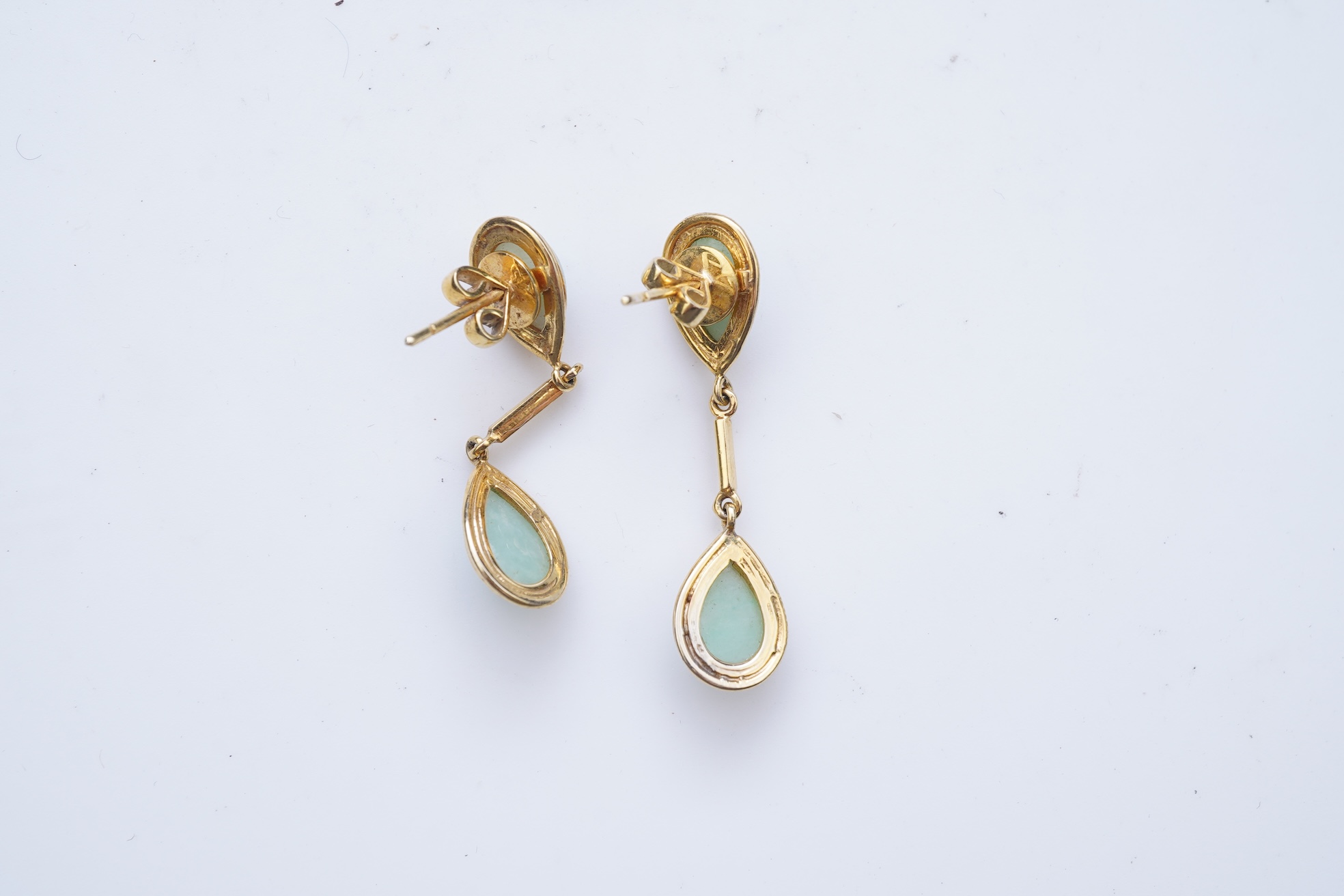 A jadeite pendant and pair of earrings